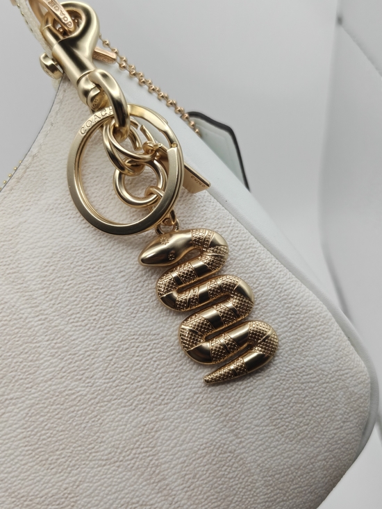 Coach Accessories - Coach Gold Snake Pendant